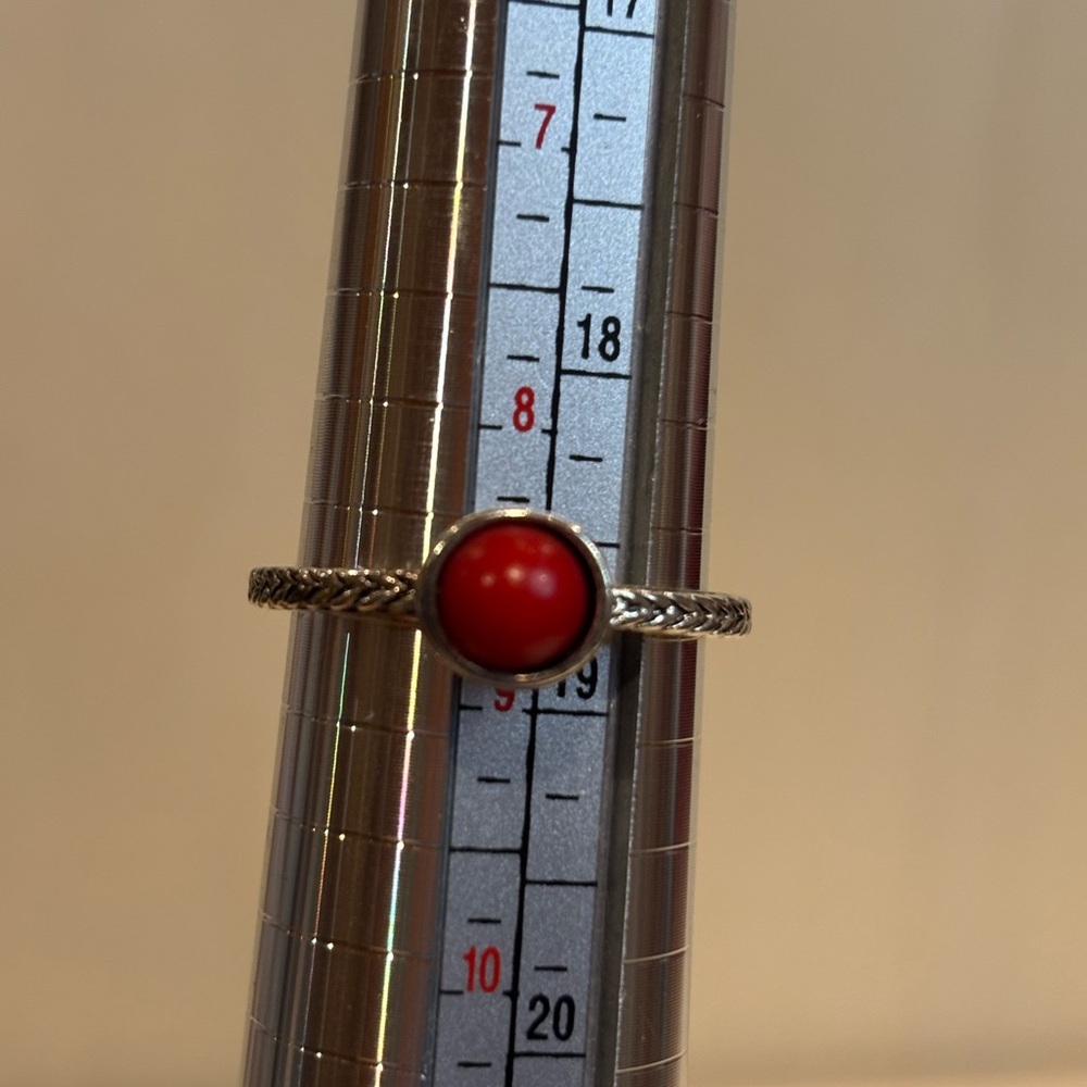 Ring silver toned with faux red stone. Size 8 3/4. Used condition
